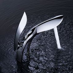 a faucet that is in the water with it's spouting out