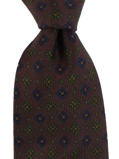 E. Marinella Ties | Wide Neckties E. Marinella Genuine E. Marinella tie, classic brown geometric design, fancy silk, hand made in Italy. Color: Brown Fabrics: 100% Silk, Self Tipped Size: Width: 3.15"/ 8cm, Regular Length 58" Origin: Hand Made in Italy Brand: E. Marinella Napoli Original E. Marinella Gift Box ( Flat ) Upon Request Genuine / Authentic Product code: mari220876 E. Marinella is a sartorial quality brand from Napoli, Italy. The E. Marinella tie designs are often classic geometric pri Elegant Brown Tie, Classic Brown Ties For Office, Brown Standard Tie, Fitted Brown Neckwear For Formal Occasions, Fitted Elegant Brown Neckwear, Elegant Fitted Brown Neckwear, Classic Brown Neckwear With Ties, Brown Semi-formal Standard Tie, Elegant Brown Suit And Tie Accessories For Office