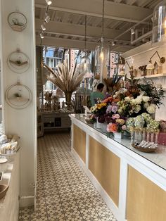 a flower shop with flowers on the counter