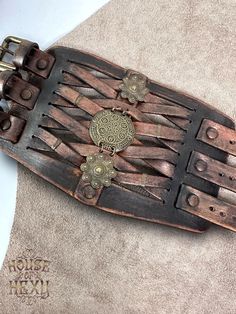 an old wooden skateboard with intricate carvings on it's sides and bottom part