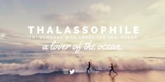 two people are running on the beach in front of an ocean with words that read thalasophile