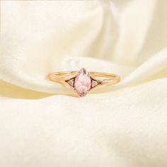 This ring with beautiful Natural sapphire, is set in 18K Solid Gold. It is a ring perfect for any gifting occasions for your loved ones. Purchase the perfect gift for your mom, wife, daughter, girlfriend, and fiancee.  -Material - 18K Solid Rose Gold -Gemstone - Natural Pink Sapphire Diamond  -Gemstone weight - 0.530  Ct  - Diamond Weight - 0.020 Ct -Gross weight - 2.13 grams In ancient times, it was thought that a pink sapphire would bring you honesty, loyalty, luck and, most importantly, love. In Asia, their hue is loved for its resemblance to the lotus flower. Today, pink sapphires are said to symbolise beauty, wisdom, purity and love, and we think it's time to celebrate them. You can also go to my shop Home for more:  https://www.etsy.com/shop/TheJewelVine We offer free resizing, and a Rose Gold Diamond Birthstone Ring Gift, Elegant Rose Gold Birthstone Ring As Gift, Rose Gold Sapphire Ring With Diamond, Gift, Oval Rose Gold Birthstone Ring For Anniversary, Rose Gold Marquise Diamond Ring Gift, Anniversary Rose Gold Sapphire Ring With Accent Stones, Dainty Rose Gold Birthstone Ring For Anniversary, Fine Jewelry Rose Gold Birthstone Ring Gift, Morganite Solitaire Diamond Ring As A Gift