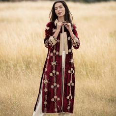 The claret silk velvet coat, with its stunning contrasting embroidery, combines elegance with style, standing out wherever you go from day to night effortlessly. Dry clean only  100% silk velvet Elegant Outerwear With Dupatta For Eid, Elegant Fall Outerwear With Zari Work, Elegant Long Kurta For Fall, Elegant Long Outerwear For Eid, Elegant Velvet Kurta With Intricate Embroidery, Elegant Velvet Kurta For Formal Occasions, Long Sleeve Velvet Kurta With Dupatta, Elegant Kurta With Zari Work For Fall, Elegant Long Outerwear With Intricate Embroidery