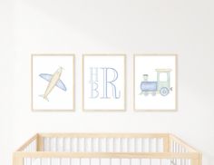 a baby's nursery room with three pictures on the wall and a crib