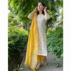 Yellow Kurti With White Pants, Kurti With Pants And Dupatta, Yellow With White Outfit, White And Yellow Floral Dress, Yellow Kurti Design Style, Yellow Kurta Woman, Yellow And White Kurti, Kurti Pants Design Latest, Yellow And White Suit