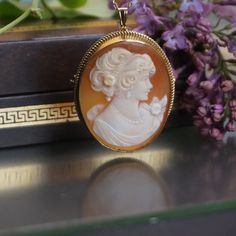 Vintage 9kt Gold Shell Cameo pendant/brooch, Solid gold cameo pendant-brooch, handcarved Cameo pendant, cameo gift for her, gift for mom,C26 Hand carved Shell Cameo Size 35,4 by 27,7 mm Framed 37,6 by 30 mm  back pin works perfect and it is straight, bail is 18kt gold plated was added later Total weight is 7,57 gram Unmarked 9 kt gold, tested and guarantied Possible to use as a pendant, please see pictures,Item is in good vintage condition no damages or repairs. Chain and the display box are not Heirloom Style Carved Brooch For Gifts, Heirloom Carved Brooches As Gift, Yellow Gold Medallion Brooches As Gift, Yellow Gold Medallion Brooches, Yellow Gold Pendant Brooches As Gift, Elegant Carved Brooches For Gifts, Oval Brooch Necklaces For Wedding, Oval Brooch Necklace For Wedding, Heirloom Engraved Brooches For Gifts