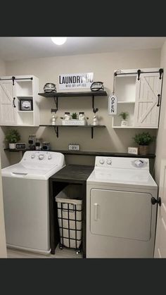 a washer and dryer in a laundry room with shelves on the wall above them