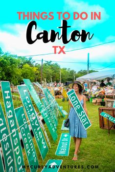 a woman standing next to green street signs with the words things to do in canton tx