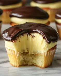 chocolate covered cupcakes sitting on top of a counter