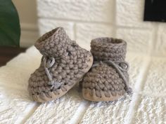 Functional as slippers or booties, these Cabin slippers will keep little toes toasty warm this winter! Hand-crafted using 100% wool, with sheepskin lining, they'll make sure your little one is comfortable all winter long. With suede soles, they're also durable enough to withstand your toddler's typical wear-and-tear.   Sizing  Newborn 0-3+ months with soles measuring approximately 4" B3- 3-12 months with soles measuring approximately 5" B5- 1-2 years with soles measuring approximately 5.5" B7- 2 Cozy Winter Slippers With Soft Sole, Winter Booties With Soft Sole And Closed Toe, Winter Beige Closed Toe Booties, Beige Closed Toe Winter Booties, Handmade Winter Indoor Slippers, Cozy Soft Booties With Round Toe, Winter Brown Slippers With Soft Sole, Handmade Comfortable Winter Booties, Comfortable Winter Booties With Soft Sole