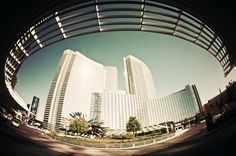 an image of the inside of a building looking up at it's surroundings and surrounding buildings