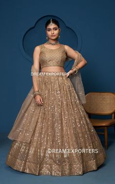 Pretty Brown Net Lehnga Choli For Women Ready To Wear Indian Wedding Lehnga Designer Party Wear lehengas Reception,Sangeet Wear Lehengas LEHENGA (Semi-Stitched): FABRIC: Soft Net WORK: Zari , Sequence Embroidery Work FLAIR: 3.50 meter Inner: Cotton With Canvas and can-can layered net SIZE : waist-42" height-42" BLOUSE (Unstitched) Blouse Fabric : Soft Net Work: Zari, Sequence Embroidery Work Blouse Size: Upto 43 Inches Bust(Un-Stitched) 0.90 mtr Unstitched DUPPTA DETAILS Duppta Fabric : Soft Net Designer Wear Gold Lehenga With Self Design, Floor-length Gold Sharara With Self Design, Party Gold Lehenga With Self Design, Bollywood Style Lehenga With Self Design For Wedding, Gold Floor-length Sharara With Self Design, Bollywood Style Wedding Lehenga With Self Design, Gold Wedding Choli With Self Design, Gold Wedding Gown With Self Design, Party Wear Lehenga With Dori Work For Wedding