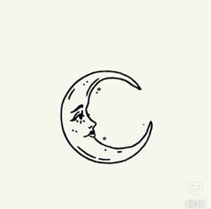 a black and white drawing of a crescent with a cat's face on it