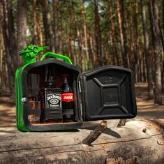 an open case with two bottles in the woods