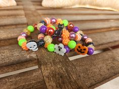 Fun, colorful beaded bracelets for Halloween.  Choose between a black cat, ghost, skull or jack-o-lantern Handmade Multicolor Bracelets For Halloween, Halloween Party Beaded Bracelets, Adjustable Multicolor Beaded Bracelets For Halloween, Multicolor Novelty Bracelets For Halloween, Novelty Multicolor Beaded Bracelets For Halloween, Halloween Novelty Beaded Bracelets With Round Beads, Halloween Multicolor Beaded Bracelets, Halloween Novelty Bracelet With Round Beads, Handmade Themed Halloween Bracelet