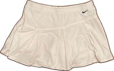 Casual Nike Tennis Skirt, Nike Casual Tennis Skirt, Nike Casual Short Tennis Skirt, Nike Spring Pleated Skirt, Casual Short Nike Skirt, Nike Casual Short Skirt, Nike Sporty White Skirt, Nike White Skort For Spring, Nike Pleated Skirt For Summer