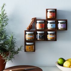 the spice rack is made out of wood and has five different types of spices on it