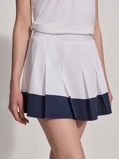 Image Sporty Summer Pleated Tennis Skirt, Summer Sports Tennis Dress With Pleats, Summer Sports Pleated Tennis Dress, Blue Tennis Skort For Spring, Sporty Pleated Tennis Dress For Summer, Blue Tennis Skort For Summer, Sporty Pleated Shorts, Summer Athleisure Tennis Skort, Summer Tennis Athleisure Skort