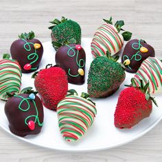 chocolate covered strawberries are arranged on a plate