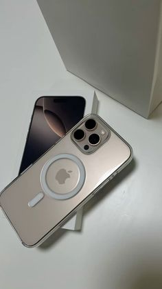 an apple iphone 11 is sitting on a table next to its box and the case