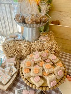 a table topped with lots of cookies and treats