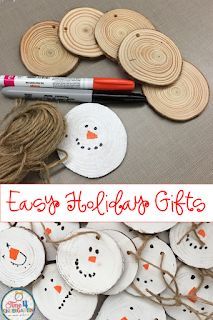 easy holiday gifts for kids to make with paper plate snowmen and wooden slices on the table