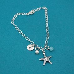 Beautiful delicate anklet with a sterling silver starfish charm. Your choice of initial and charm drops to customize to make it all your own. All dangle from 5.8mm sturdy sterling silver jump rings on a sturdy adjustable link chain with a sterling silver lobster clasp. Perfect for beach weddings! If you need extra birthstone crystals, follow this link: https://www.etsy.com/listing/113710100/one-sterling-silver-plated-flat If you would like extra tiny initials, follow this link: https://www.etsy. Adjustable Silver Charm Bracelet With Starfish, Silver Charm Bracelet With Starfish For Beach, Silver Starfish Charm Bracelet For Beach, Summer Jewelry Beach, Starfish Anklets, Birthstone Crystals, Bracelet Summer, Jewelry Beach, Beach Weddings