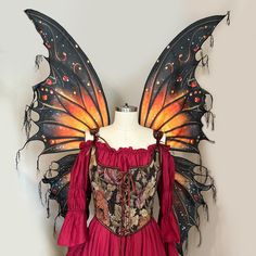 a dress made to look like a butterfly with wings on it's chest and back