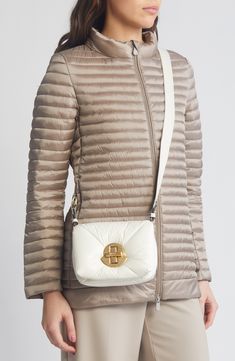 Moncler's iconic puffers inspire this down-filled quilted bag made of glossy lacquered nylon and finished with a bell-shaped clasp that nods to the logo patch. Turnlock closure Adjustable crossbody strap Lined, with down fill Textile with leather trim Imported Designer Handbags Nylon Crossbody Bag, Mini Crossbody Bag, Quilted Bag, Mini Crossbody, White Bag, Crossbody Strap, Leather Trim, Leather Trims, Bag Making