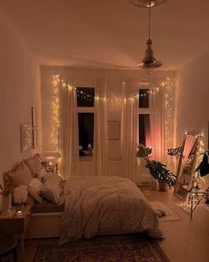 a bedroom decorated with lights and fairy lights