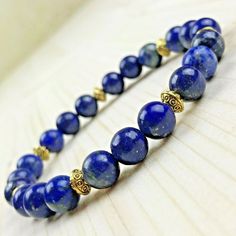 Genuine gemstone bracelet Lapis Lazuli 8mm Golden Tibetan Pearls Delivered in its organza pouch Elegant Crystal Gemstone Bracelet For Meditation, Natural Lapis Lazuli Bracelets, Elegant Lapis Lazuli Gemstone Bracelets, Adjustable Lapis Lazuli Beaded Bracelets With Gemstone, Lapis Lazuli Bracelets For Meditation, Elegant Handmade Lapis Lazuli Bracelets, Elegant Lapis Lazuli Jewelry For Healing, Gift Lapis Lazuli Round Bead Bracelets, Lapis Lazuli Bead Bracelet Gift