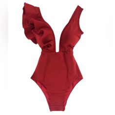 The Stunning Cosmopolitan Swimsuit In Red Features A One-Sided Ruffle Shoulder And Comes With A Multi-Colored Gem Belt Embellishment. High-Quality Double-Lined Polyester And Spandex Fabric That Allows For Quick Drying And Breathability. Padding Inserts Are Built In For Extra Volume And Support. - Polyester And Spandex Fabric - Breathable And Quick Dry - High Elasticity - Double Lined - Built-In Padding - Full Coverage Elegant Red Backless Swimwear, Elegant Red Swimwear For Pool, Solid Color Beachwear Bodysuit For Parties, Stretch V-neck One Piece For Party, Chic Solid Color Party One Piece, Elegant Solid Color Club Swimwear, Elegant Solid Swimwear For Club, Party One-piece With Lined Body, Solid Color V-neck Party Swimwear