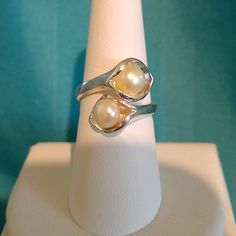 This Pretty Calla Lily Wrap-Around Ring Features Two Cultuted Pearls, One Inside Each Lily. Created By An Artisan In India. Stamped .925. New And Unworn. Elegant Adjustable Nickel Free Rings, Elegant Adjustable Nickel-free Rings, Sterling Silver Pearl Ring With Polished Finish For Anniversary, Polished Finish Pearl Ring As Gift, Stamped 925 Pearl Ring For Wedding, Wedding Pearl Ring Stamped 925, Elegant Sterling Silver Bypass Ring With Open Band, Elegant Nickel-free Toe Ring, Adjustable Bypass Ring For Formal Occasions