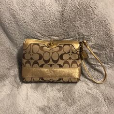 Beautiful Never Used Coach Signature Wristlet, Tan With Gold Accents Gold Rectangular Wristlet For Gifts, Coach Gold Clutch Wristlet, Coach Clutch Wristlet For Travel, Coach Travel Wristlet Clutch, Gold Coach Clutch Wristlet, Elegant Gold Coach Wristlet, Coach Gold Rectangular Wristlet, Coach Gold Wristlet For Everyday Use, Gold Coach Wristlet For Everyday