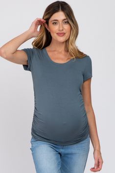 A solid short sleeve fitted top with a round neckline and side ruching. The Deep Teal Basic Short Sleeve Maternity Fitted Top is perfectly bump-friendly! Casual Ruched Short Sleeve T-shirt, Summer Fitted Bump Friendly Tops, Spring Short Sleeve Tops, Bump Friendly, Spring Short Sleeve Bump-friendly Tops, Bump-friendly Short Sleeve Tops For Spring, Spring Bump Friendly Short Sleeve Tops, Short Sleeve Ruched Stretch T-shirt, Ruched Stretch Short Sleeve T-shirt, Fitted Ruched Short Sleeve T-shirt