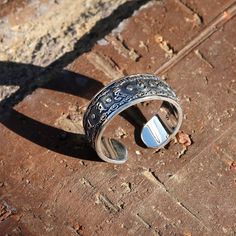 "This is a new style adjustable sterling silver ring features Buddhist Prayer \"Om Mani Padme Hum\" in Tibetan characters on the outside. The embossed Powerful Six Symbols in Tibetan Buddhism are: 唵（om�）、嘛（ma）、呢（ni）、叭（pad）、咪（me）、吽（hum）. This simply elegant Buddhist Prayers Ring reminds us the key philosophy of Buddhism - All is Void. Humans often get loss in life while putting too much effort on judging others or complaining the surroundings, without realizing the world is just the reflection of Buddhist Prayers, Prayer Ring, Buddhist Symbols, Buddhist Prayer, Om Mani Padme Hum, Chinese Symbols, Meditation Rings, Ring Mens, Tibetan Buddhism