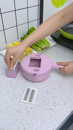 a person is using a sponge to clean a counter top with an electric scrubber