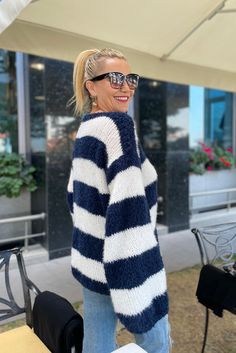 ✨ Elegant Striped Design: Step into style with our women's striped mohair sweater. The classic navy blue and white stripes offer a timeless look, making it a versatile addition to any wardrobe. 🧶 Hand Knit with Love: Each of our striped pullovers is hand-knit, ensuring a unique and personal touch. The craftsmanship speaks of quality and care, perfect for those who appreciate artisanal beauty. 🌟 Luxurious Mohair Blend: Experience the softness and comfort of our fluffy mohair jumper. The mohair blend provides warmth without the weight, ideal for staying cozy on cooler days. ⚓ Nautical Inspired Color Palette: Inspired by the serene colors of the sea, the navy blue and white palette brings a sense of calm and sophistication to your outfit, suitable for both casual and formal occasions. ️ Per Casual Blue Sweater With Contrast Stripes, Navy Stripe Sweater, Oversized Hand Knitted Blue Sweater, White And Blue Striped Chunky Sweater, Marine Stripe Sweater, Sweater Navy Blue, Mohair Jumpers, Striped Pullover, White Palette