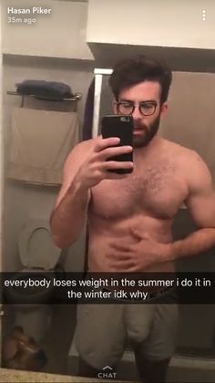 a shirtless man taking a selfie in front of a mirror with the caption, everybody loses weight in the summer i do it in the winter skis why