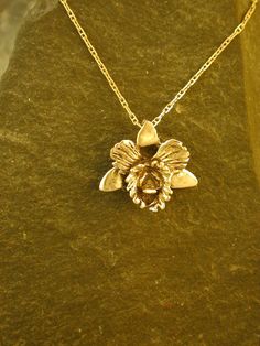 "This solid 3 Dimensional Original Catalaya Orchid is 14K Gold The included chain is a 14K Gold chain. You may chose 16, 18 or 20 inch at the same price. Other length available at sightly higher prices. The Orchid pendant measures 3/4\" tall by 7/8\" across. I hand cast all my pieces using the lost wax casting method.  Please ask your needs. You may call me with questions, often I am out so please use my machine. 831-476-3176. Satisfaction Guaranteed! I send items USPS First Class unless otherwi Orchid Pendant, Orchid Necklace, Gold Orchid, The Orchid, Wax Casting, Jewelry Lookbook, Gold Accessories, Lost Wax, Hand Cast