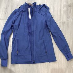 Pre-Owned But Almost Brand New. Only Worn A Handful Of Times. No Defects. Perfect To Wear During Morning Run Or On A Brisk Day. Slim Fit, Hip Length Functional Blue Outerwear For Workout, Blue Spring Outerwear For Workout, Blue Spring Workout Outerwear, Spring Workout Blue Outerwear, Blue Outdoor Activewear For Fall, Blue Hooded Outerwear For Workout, Morning Run, Athletic Clothes, Morning Running