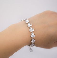 This lovely bracelet is rhodium plated and incrusted with cubic zirconia stones. It's very sparkling in person!The length of the bracelet is approximately 6.68" (16,4cm) with 1.5" extender (4 cm). ***All my designs are shipped from France. Please make sure you have enough time to get your purchase! Adjustable Cubic Zirconia Sterling Silver Wedding Bracelet, White Sterling Silver Crystal Bracelet For Wedding, Sparkling Sterling Silver Diamond Bracelet For Wedding, Sterling Silver Bracelet With Sparkling Stones For Wedding, Silver Sterling Silver Tennis Bracelet For Wedding, Sterling Silver Wedding Bracelet With Sparkling Stones, Silver Cubic Zirconia Chain Bracelet For Wedding, Wedding White Sterling Silver Bracelet With Cubic Zirconia, Sterling Silver Cubic Zirconia Bracelet For Wedding