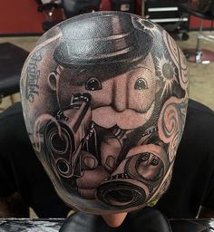 a man with a tattoo on his head