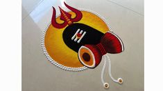 an artistically designed design on the floor with thread and beads for decoration or wall hangings