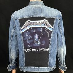 "The graphics for this jacket come from an recent artist shirt. The Levi's jacket is a men's Large or women's Xlarge. Please be sure to compare the measurements to a jacket you currently wear." -- Mark E. Chase, designer Men's Large or Women's XLarge - check measurements. Levi's red tab denim jacket with Metallica graphics sewn to the back panel. Each jacket is a unique creation of upcycled clothing. No two are alike. Every jacket comes with a limited edition pin. Armpit to Armpit: 24" Down the back: 27" Shoulder seam to shoulder seam: 20" Shoulder seam to end of cuff: 25" Pre-owned - Some fading and wear, inside tag missing. (see photos) Returns always accepted Inv# 113-2536 Denim Paint, Ride The Lightning, Artist Shirts, Levis Denim Jacket, The Lightning, Levis Jacket, Painted Denim, Upcycled Clothing, Levis Denim