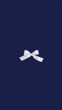 a white bow on a dark blue background