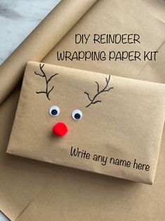 an envelope with a reindeer face on it and the words, diy reindeer wrapping paper kit write any name here