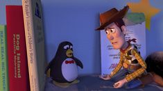 a cartoon character sitting on top of a book shelf next to a penguin and other books