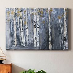 an abstract painting of trees with yellow leaves