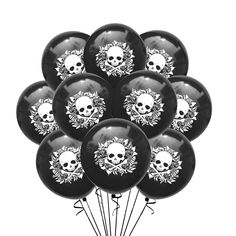 a bunch of black and white balloons with skulls on them